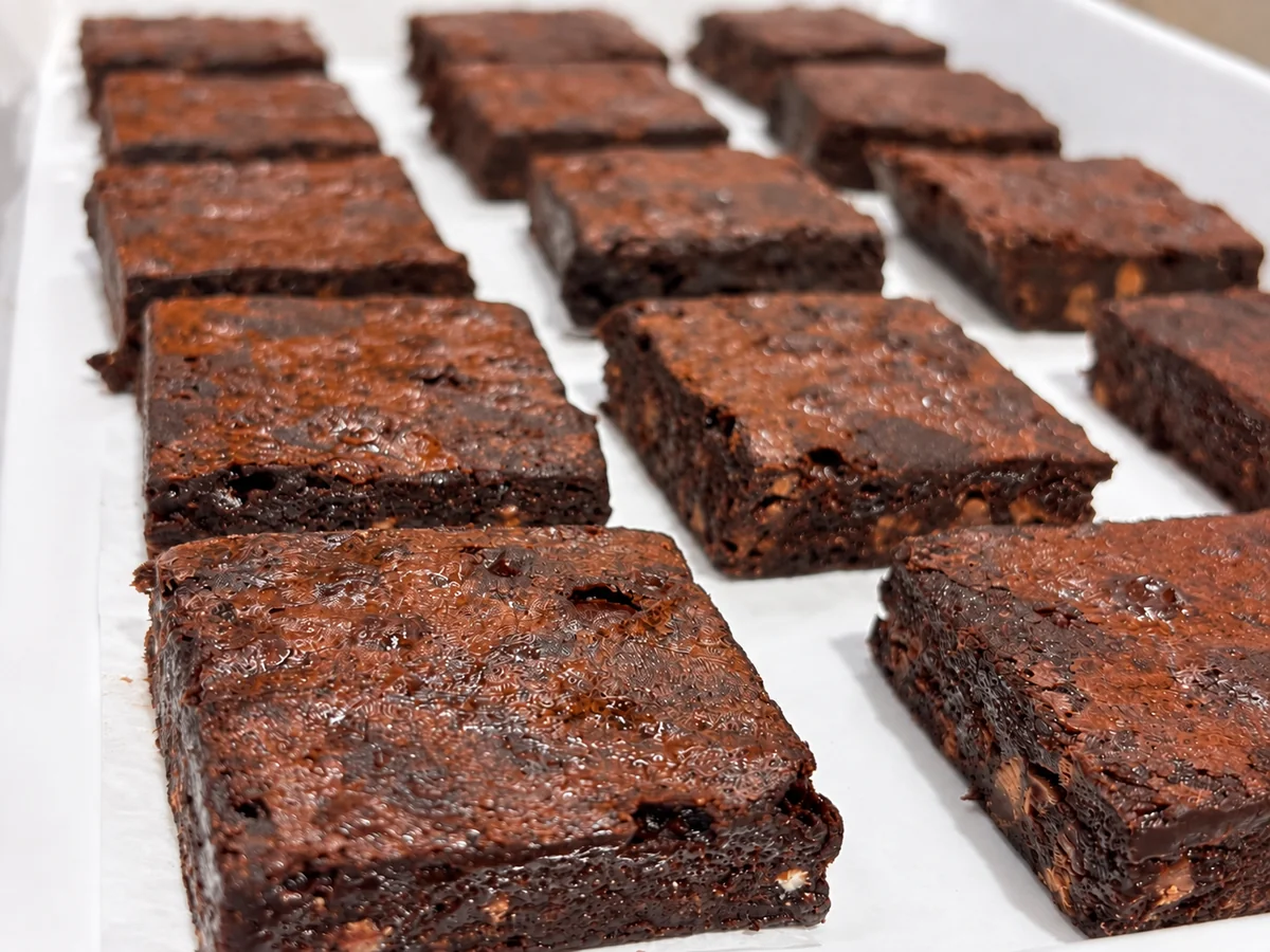 SOS Counter’s chocolate fudge brownies on a parchment-lined tray